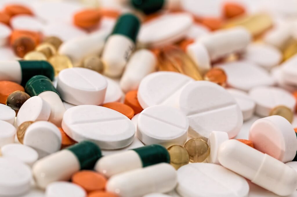 headache pain pills medication 159211 Close-up of various pills and capsules in different colors and sizes, ideal for healthcare-related content.