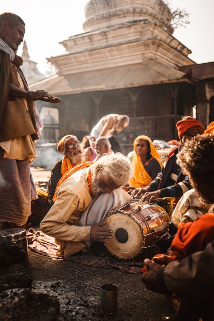 pexels photo 11738985 Pilgrims gather at a temple in Kathmandu, engaging in traditional music and rituals.