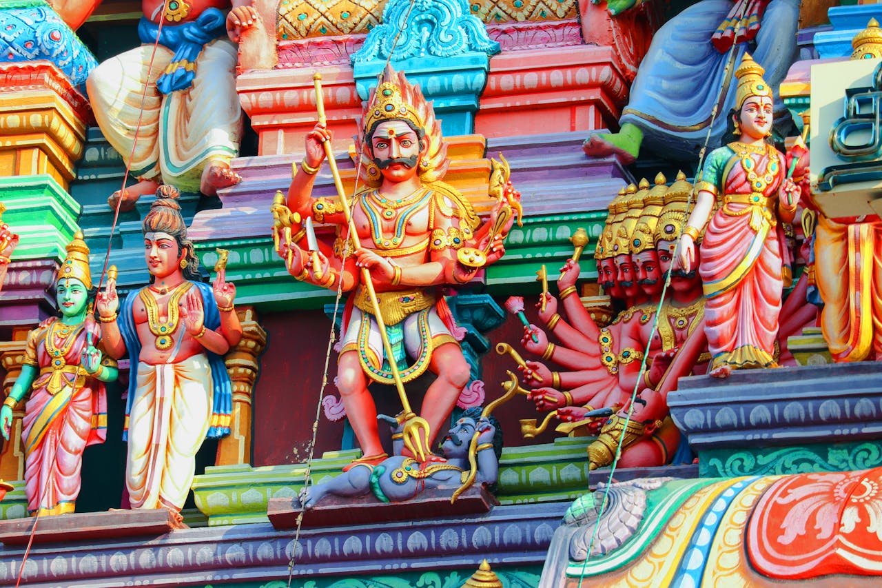 services-01 Vibrant statues depicting Hindu deities on a temple facade in Chennai, showcasing rich cultural art.